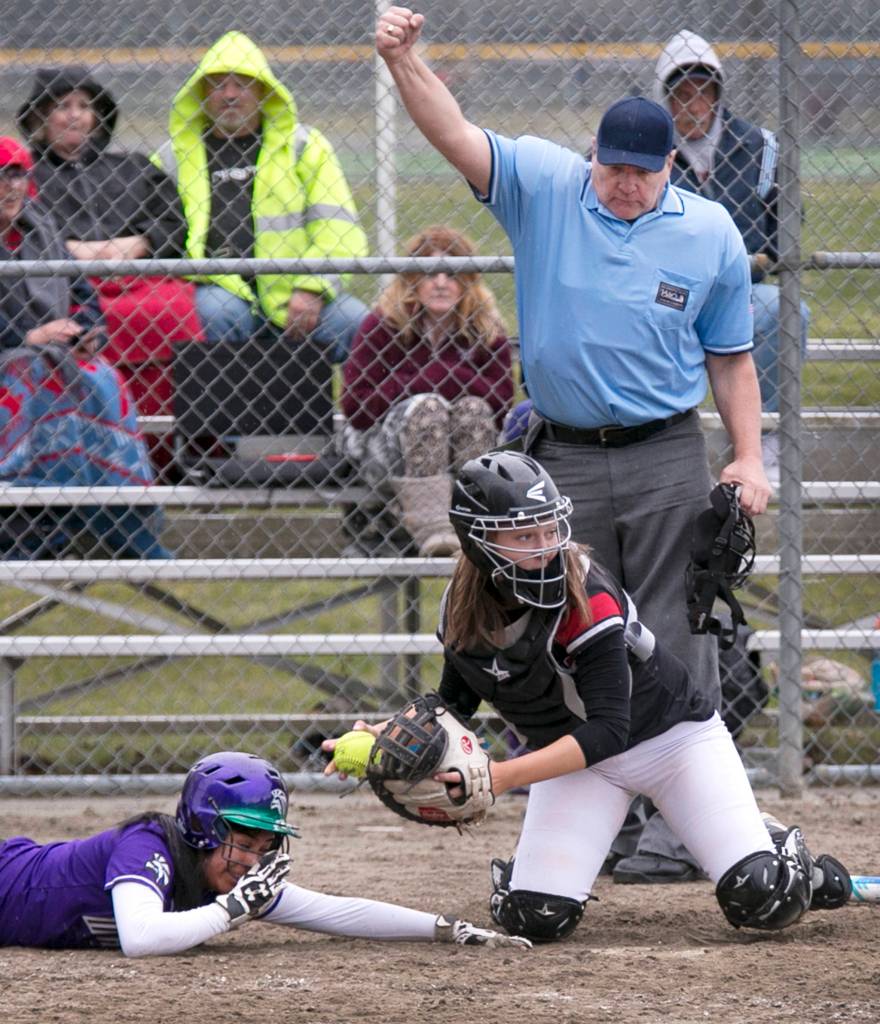 Edmonds-Woodways Sofia Chamorro (left) is tagged out by Mountlake Terraces Jamie Bingaman at Mountlake Terrace High School on March 21. Edmonds-Woodway won 7-5. (Kevin Clark / The Herald)