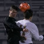 Jacksons Jake Williams (left) and Lake Stevens Ethan Anastasi jump for a header Wednesday at Lake Stevens High School. (Kevin Clark / The Herald)