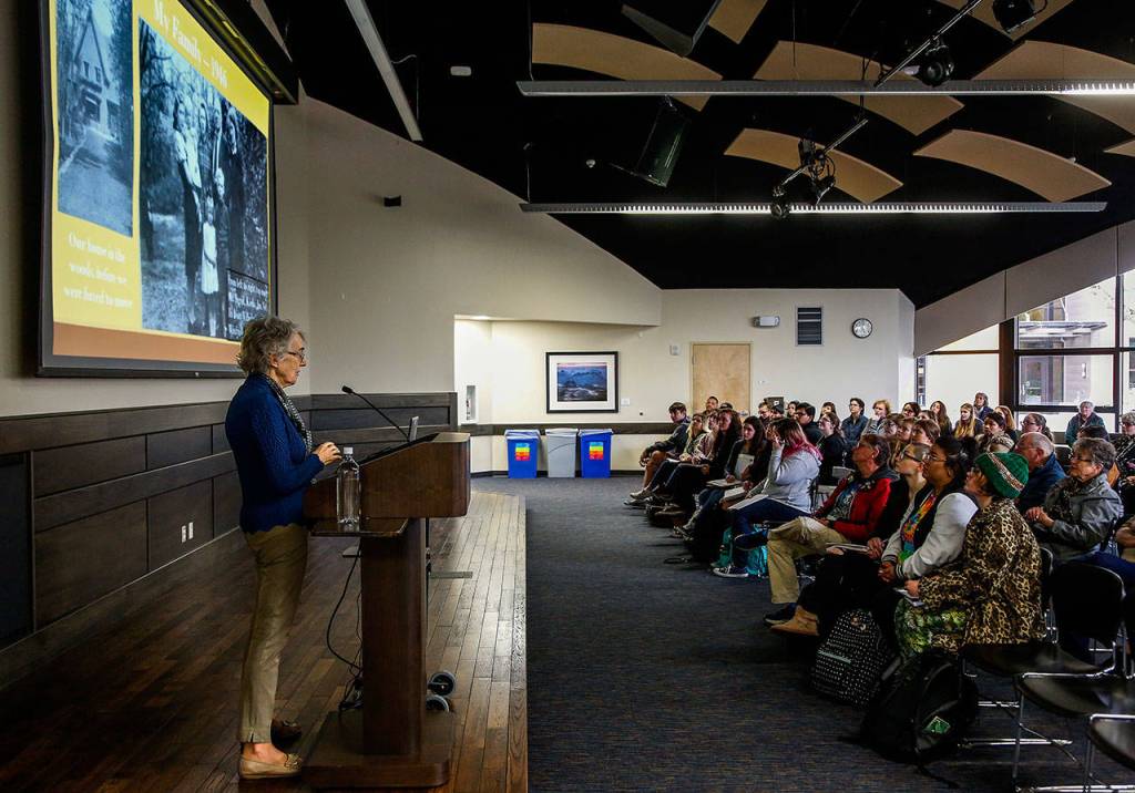 In EvCCs Jackson Center Wilderness Room, Ingrid Steppic, who was born during Nazi occupation of The Netherlands, talks about her partents helping hide 40 Jews. Her father warned others not to register but to hide. (Dan Bates / The Herald)