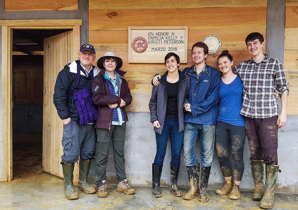 Marysville dentist Dr. Kelly Peterson and his wife, Kristi Peterson, with their family members outside the school they helped build last month in a Guatemalan village. With them are their sons, Michael, center with his fiance Lisa Rodney (left), and Matthew, at right with cousin Kaitlyn Peterson. (Larry Jubie photo)