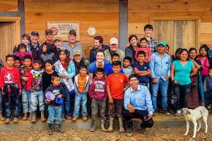 Guatemalan villagers join with volunteers from the Hands for Peacemaking Foundation outside the school the Everett-based nonprofit helped build last month in the village of Canton Maya Jaguar. (Larry Jubie photos)