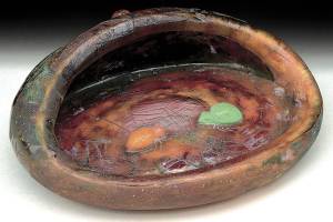 This warped-looking bowl keeps whatever is in your pockets