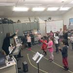 A grant-funded piano is already greatly appreciated and in use by teacher Teresa Estes and her students after Meadowdale Elementary School. (Contributed photo)