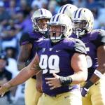 Washington defensive lineman Greg Gaines (99) celebrates a sack against Idaho in the first half of a game Sept. 10, 2016, in Seattle. (AP Photo/Ted S. Warren)