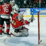 A shot by Silvertips forward Garrett Pilon (not pictured) flies past the outstretched glove of Portland goaltender Cole Kehler (center) for a goal in the second period of a second round playoff game at Angel of the Winds Arena in Everett on Saturday, April 7. (Ian Terry / The Herald)