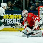 Silvertips right wing Patrick Bajkov (left) moves the puck past Portland goalie Cole Kehler for a goal in the first period of a second round playoff game at Angel of the Winds Arena in Everett on Saturday, April 7. (Ian Terry / The Herald)