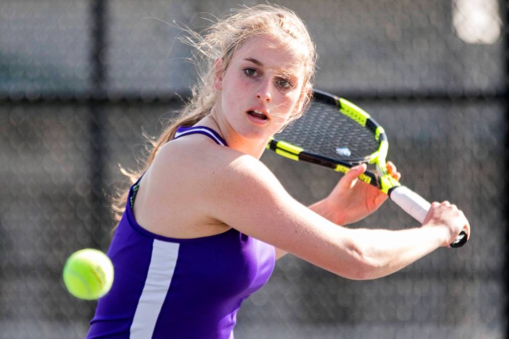 Emily Peterson practices her tennis game at Lake Stevens High School on March 21. (Kevin Clark / The Herald)