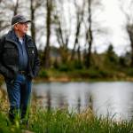 Last year, Reiner suffered a heart attack not far from the idylic pond (background) that he created on his farm along the Skykomish River at Monroe. He survived and is doing well, but he and his wife Charlene have chosen to sell the farm in a way that will protect it from future development. The farm has been in the family for more than 100 years. (Dan Bates / The Herald)
