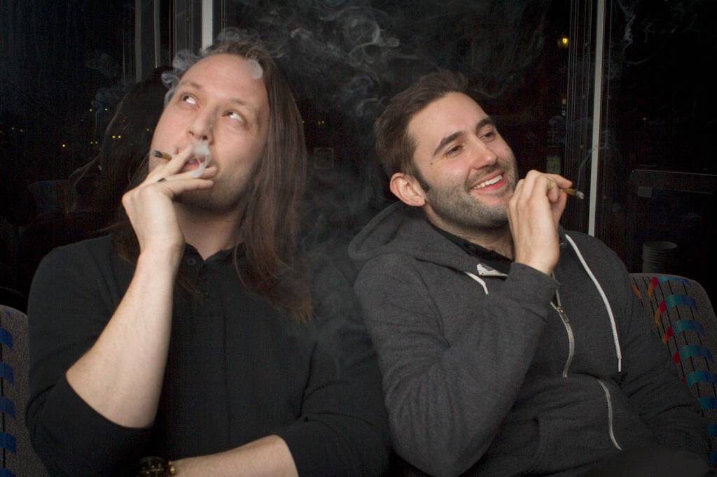 Tyler Smith (left) and Brent Flyberg smoke weed before returning to the stage to perform high at one of The Dope Shows previous performances. (Danielle Mathias)