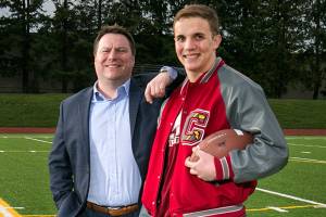 Chris Rabideau (far right) with Big Brother Clint Diehm (Kevin Clark / The Daily Herald)
