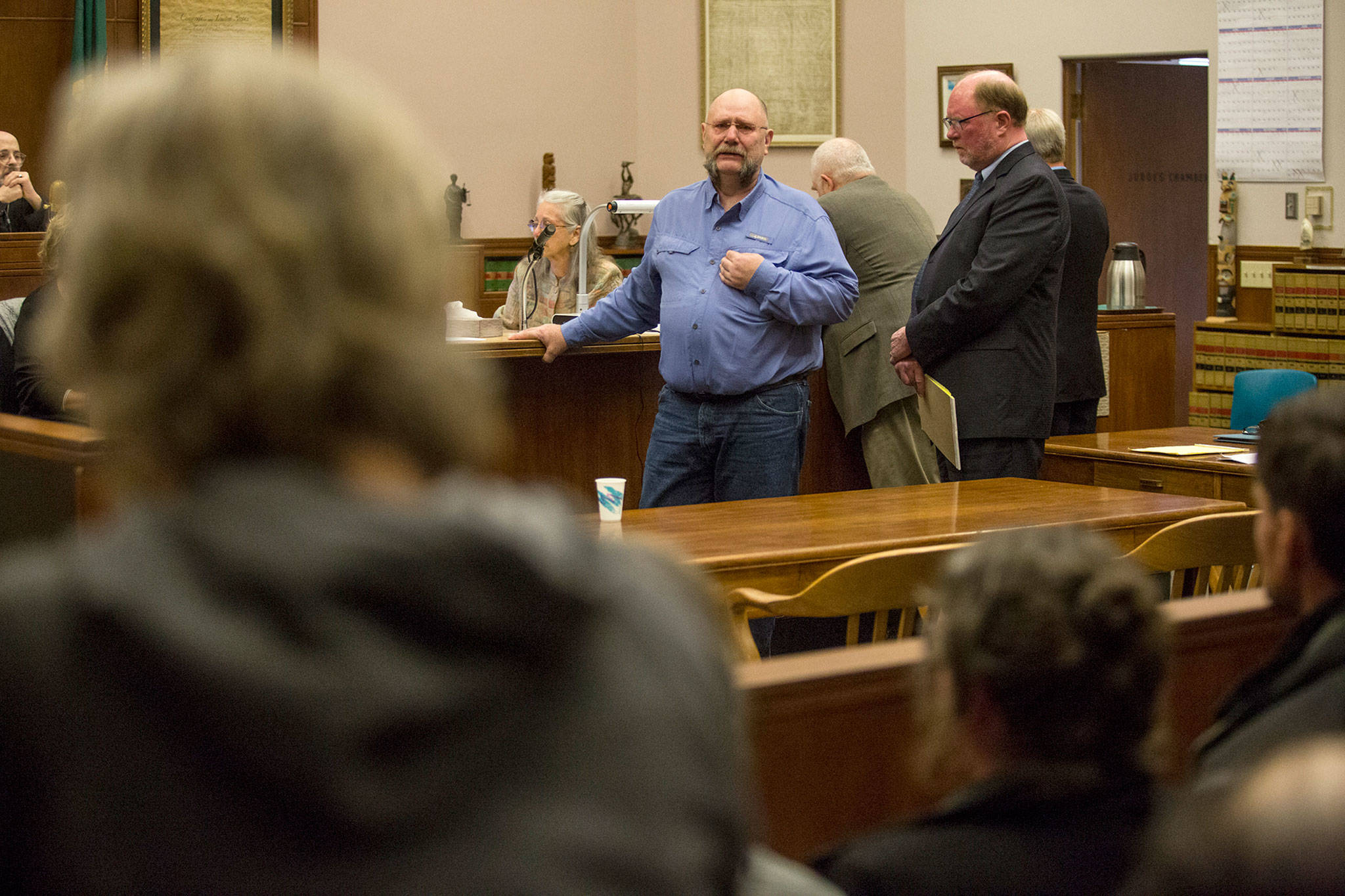 Former Island County corrections officer Mark Moffit cries as he apologizes to the family of Keaton Farris during sentencing at the Whatcom County Courthouse in Bellingham on Tuesday. Farris died of dehydration and malnutrition in the Island County Jail in 2015. Moffit and fellow former corrections officer David Lind were sentenced for forging their safety logs to make it seem like they’d been checking on Farris more often than they did. (Andy Bronson / The Herald)