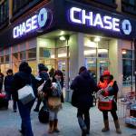 People walk past a branch of Chase bank on Jan. 14 2015 in New York. (Mark Lennihan / AP Photo)