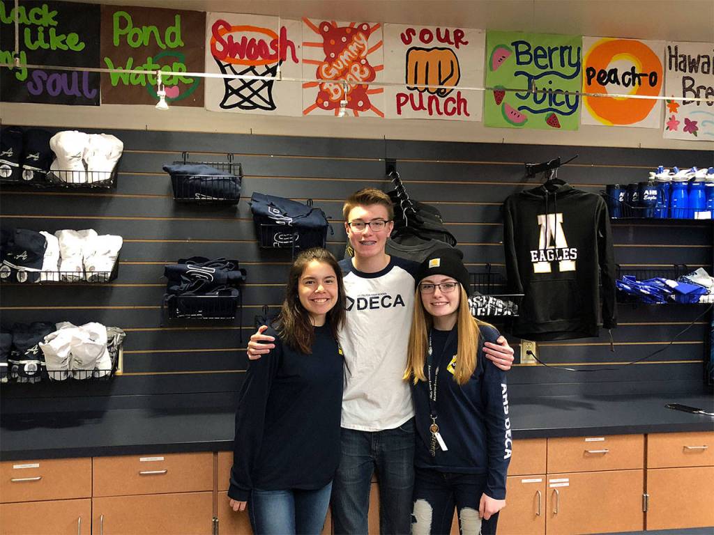 Arlington High School DECA members Caitlynn Billy, Trenten Washer, and Alexa Casey qualified for the DECA International Career and Development Conference for their work running the school store. (Contributed photo)