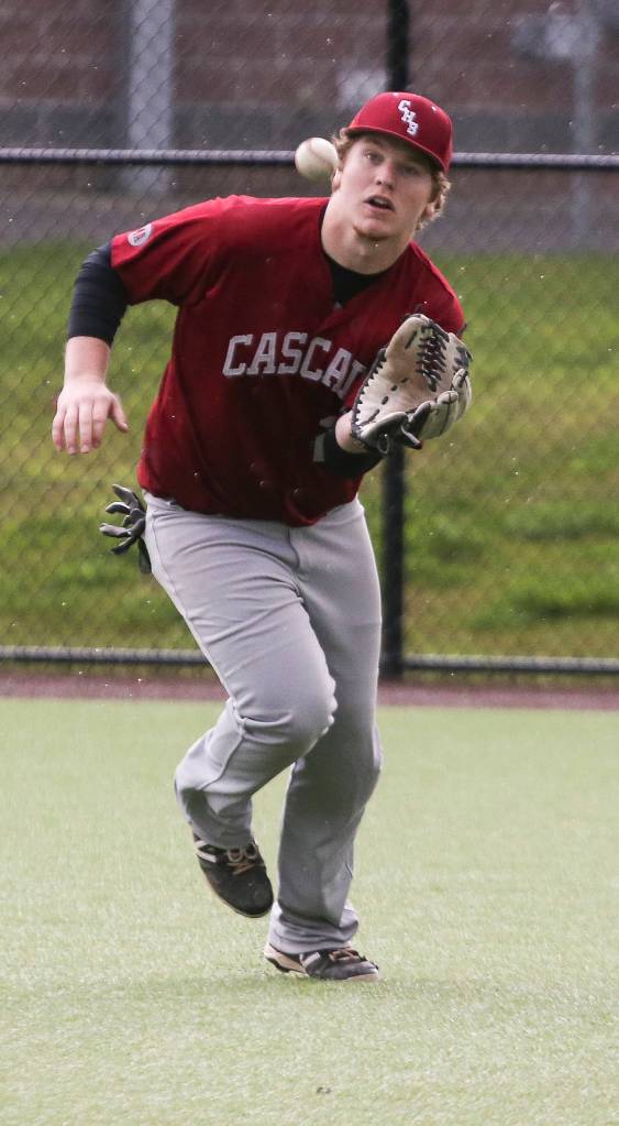 Cascades Sam Barnes hauls in a catch in the outfield during a game against Monroe on April 17, 2018, in Monroe. (Andy Bronson / The Herald)
