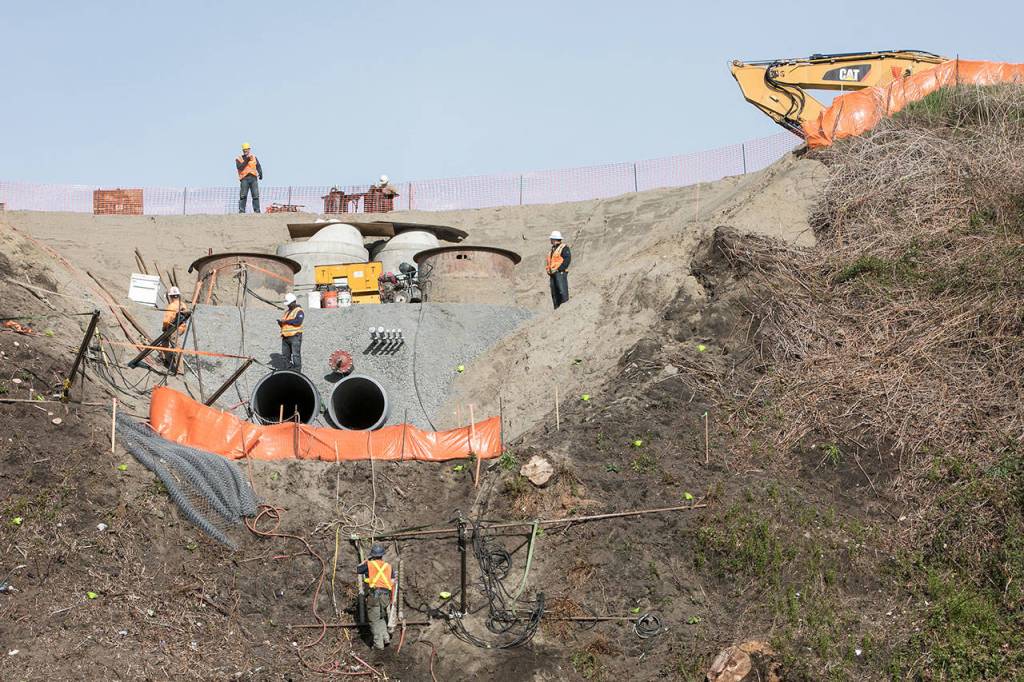Workers construct the new Grand Avenue Bridge that will connect the Northwest neighborhood with the port in 2019. (Lizz Giordano / The Herald)