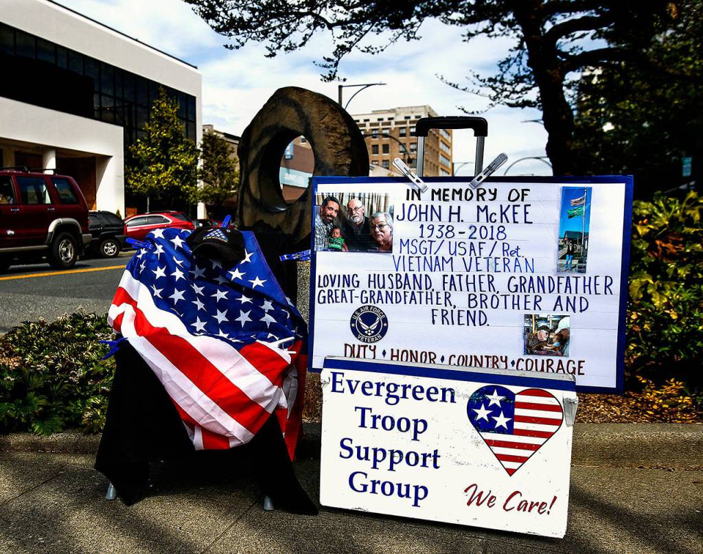 A memorial to John H. McKee sits in the same spot he sat on many a Friday, the northeast corner of Hewitt and Colby in downtown Everett. (Dan Bates / The Herald)