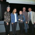 James Osborn (center) receives a Youth Conservation Leader of the Year award. Hes pictured with, from left, Maia Bellon, Washington Department of Ecology director, Stephanie Wright, Snohomish County Council chair, Mark Craven, Snohomish Conservation District Board chair, and Monte Marti, SCD district manager. (Contributed photo)