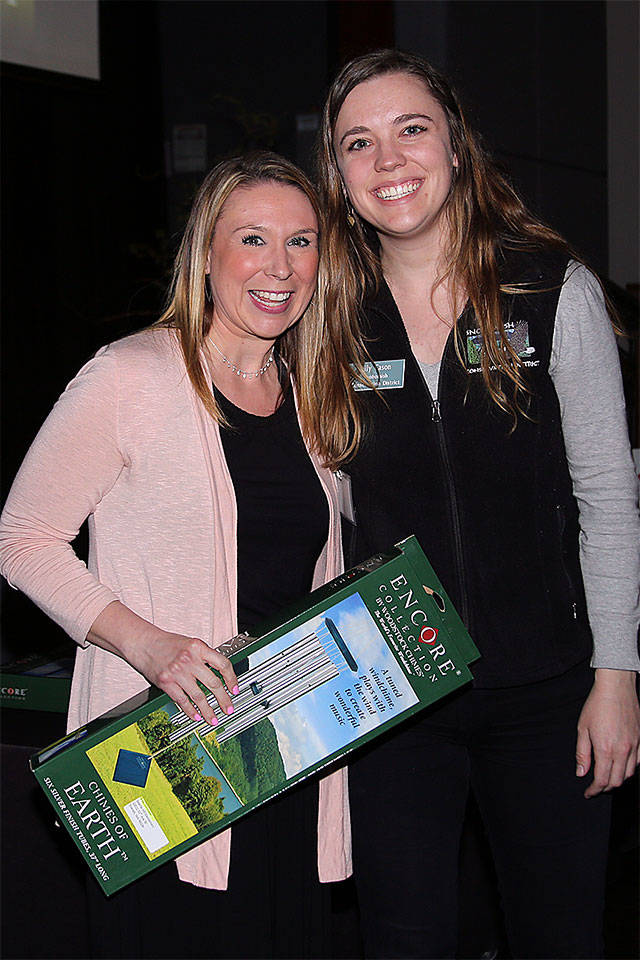 Seattle Hill Elementary School teacher Brea Dormaier receives a Conservation Leader of the Year Award from Snohomish Conservation District Youth Educator Lily Cason. (Contributed photo)