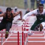 Franklin Pierces Tyrell Edge (left) beats Edmonds-Woodways Aaron Richardson by .04 seconds in the 110-meter hurdles during the annual Larry Eason Invitational on April 21, 2018, at Veterans Memorial Stadium in Snohomish. (Kevin Clark / The Herald)