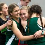Edmonds-Woodways distance medley relay team celebrates their first-place finish at the annual Larry Eason Invitational on April 21, 2018, at Veterans Memorial Stadium in Snohomish. (Kevin Clark / The Herald)