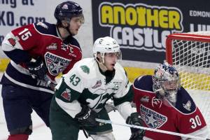 Everetts Connor Dewar (center) watches the action surrounded by Tri-Citys Michael Rasmussen (left) and Tri-Citys Patrick Dea at Angel of the Winds Arena Saturday night in Everett on April 21, 2018. (Kevin Clark / The Daily Herald)