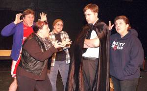 Famine (Keith Gehrig), War (Rita Baxter), Pestilence (Julie Bryan), Death (Garrison Whaley-Sharp) and Caroline (Sherry Penoyer) fight over plans for the Apocalypse in Red Curtains production of The Family Business. (Photo by Kenny Randall)