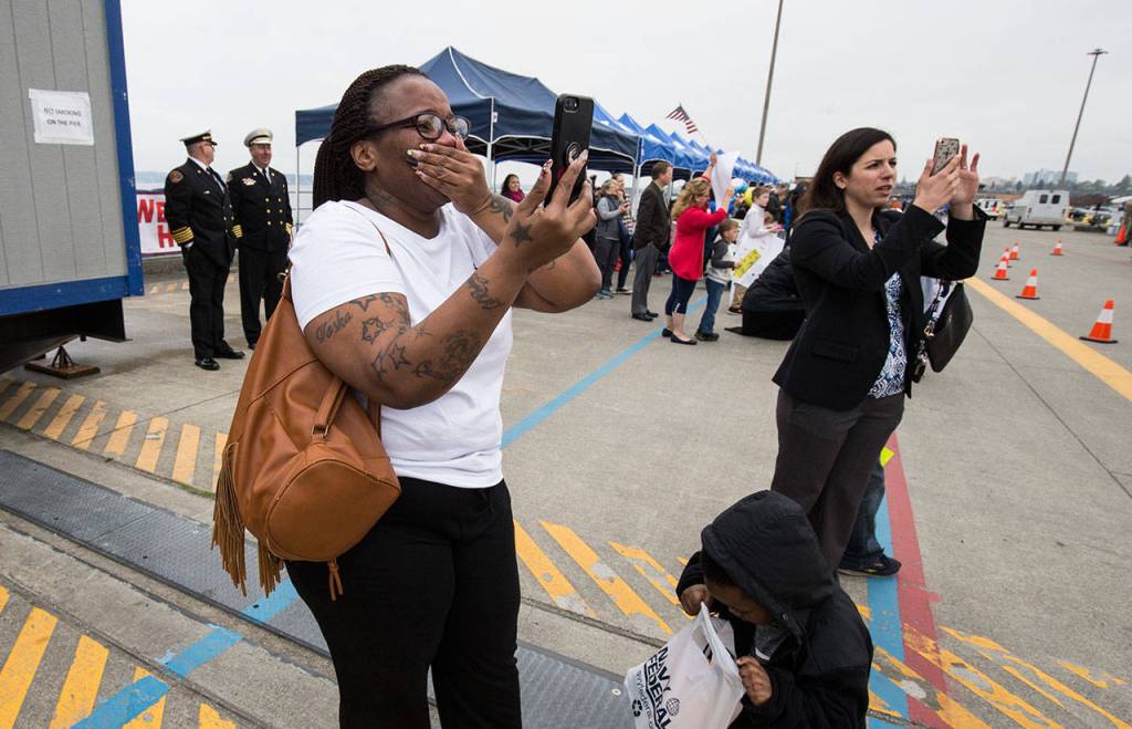 Toska Littlejohn is overwhelmed with emotion as she spots her husband, electronics technician Kurt Littlejohn, after the Navy destroyer USS Ralph Johnson arrived at Naval Station Everett on Friday. (Andy Bronson / The Herald)