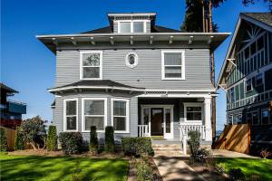 A 1907 beauty of a house at 2108 Rucker Ave. in Everett has been restored and renovated into six apartments after sitting empty and in disrepair for 15 years. Its owners now seek listing on the Everett Register of Historic Places.The house is next to the one Everetts Bill Belshaw renovated in 2012. (Dan Bates / The Herald)