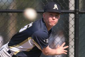 Freshman Jacob Burkett warms up in the bull pin against Lake Stevens on Thursday afternoon in Lake Stevens on April 26, 2018. (Kevin Clark / The Daily Herald)