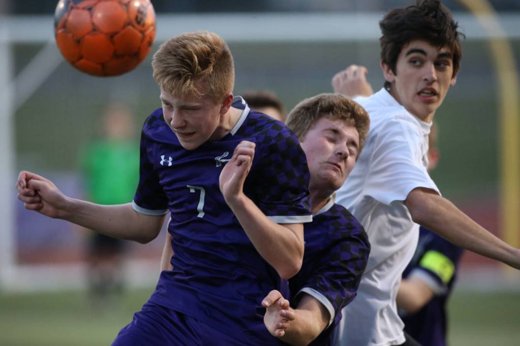 Kamiaks Kaydin Wall heads the ball as Kamiak beat Lake Stevens 2-1 in a soccer match on Tuesday, April 24, 2018 in Lake Stevens, Wa. (Andy Bronson / The Herald)