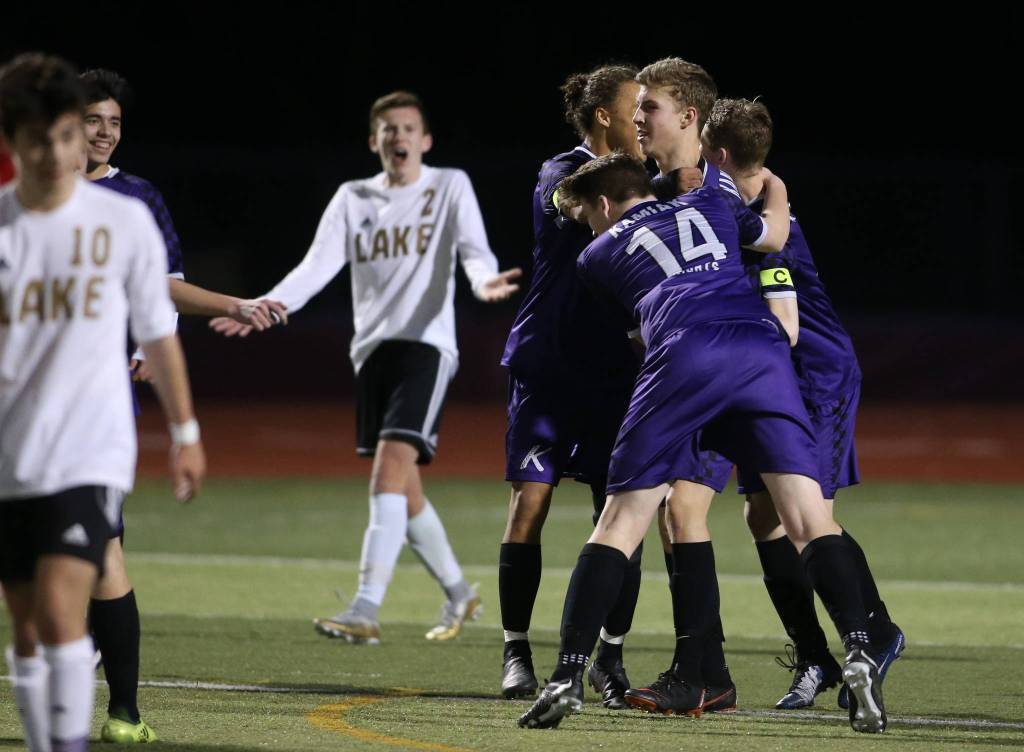 Kamiaks Noah Venditto is surrounded by teammates after scoring the second goal as Kamiak beat Lake Stevens 2-1 in a soccer match on Tuesday, April 24, 2018 in Lake Stevens, Wa. (Andy Bronson / The Herald)