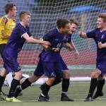 Kamiak players surround Andre Hamilton (10) after his goal against Lake Stevens on Tuesday, April 24, 2018 in Lake Stevens, Wa. (Andy Bronson / The Herald)