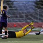Kamiaks Andre Hamilton kicks the ball past Lake Stevens goalie JJ Smith as Kamiak beat Lake Stevens 2-1 in a soccer match, with two Lake Stevens goals called back, on Tuesday, April 24, 2018 in Lake Stevens, Wa. (Andy Bronson / The Herald)
