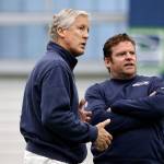 Seahawks head coach Pete Carroll (left) and general manager John Schneider talk during rookie minicamp on May 8, 2016, in Renton. (AP Photo/Elaine Thompson)