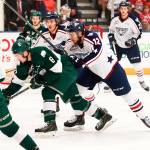 Silvertips forward Patrick Bajkov (8) battles Americans forward Jordan Topping (12) for a loose puck during a playoff game on April 26, 2018, in Kennewick. (Doug Love / Tri-City Americans)