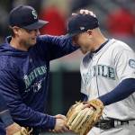 Seattle manager Scott Servais congratulates third baseman Kyle Seager after the Mariners defeated the Cleveland Indians 5-4 on Thursday in Cleveland. (AP Photo/Tony Dejak)