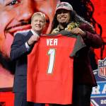 Washingtons Vita Vea (right) poses with commissioner Roger Goodell after being picked by the Buccaneers in the first round of the NFL draft on April 26, 2018, in Arlington, Texas. (AP Photo/David J. Phillip)