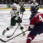 The Silvertips Patrick Bajkov (left) takes a shot with Tri-Citys Roman Kalinichenko defending during Game 5 of the Western Conference finals on April 28, 2018, at Angel of the Winds Arena in Everett. (Kevin Clark / The Herald)