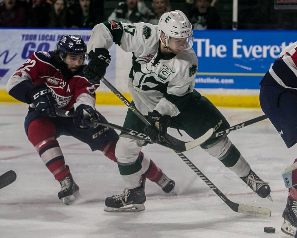 The Silvertips Matt Fonteyne (right) makes a run at goal with Tri-Citys Nolan Yaremko trailing during Game 5 of the Western Conference finals on April 28, 2018, at Angel of the Winds Arena in Everett. (Kevin Clark / The Herald)