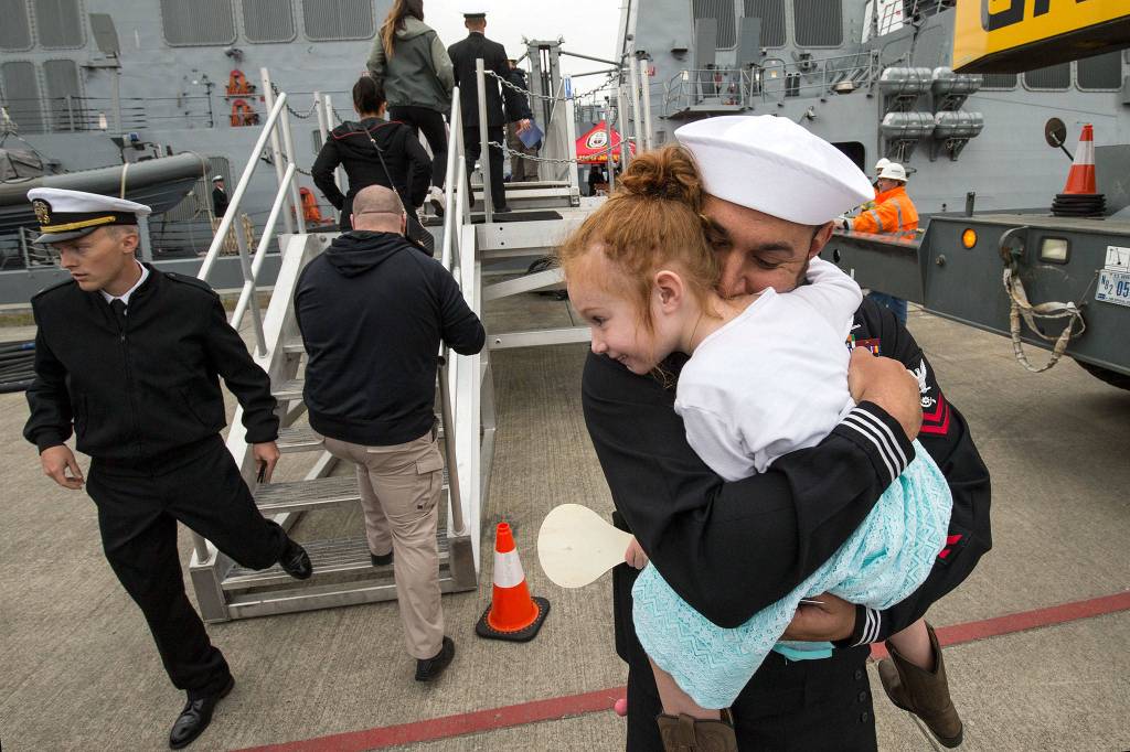 Petty Officer Kyle Byrd hugs his daughter Aleyna, 4, as the Navy destroyer <a href="http://www.heraldnet.com/news/a-brand-new-destroyer-arrives-at-its-home-port-of-everett/" target="_blank">USS Ralph Johnson arrives at Naval Station Everett</a> on April 27. (Andy Bronson / The Herald)