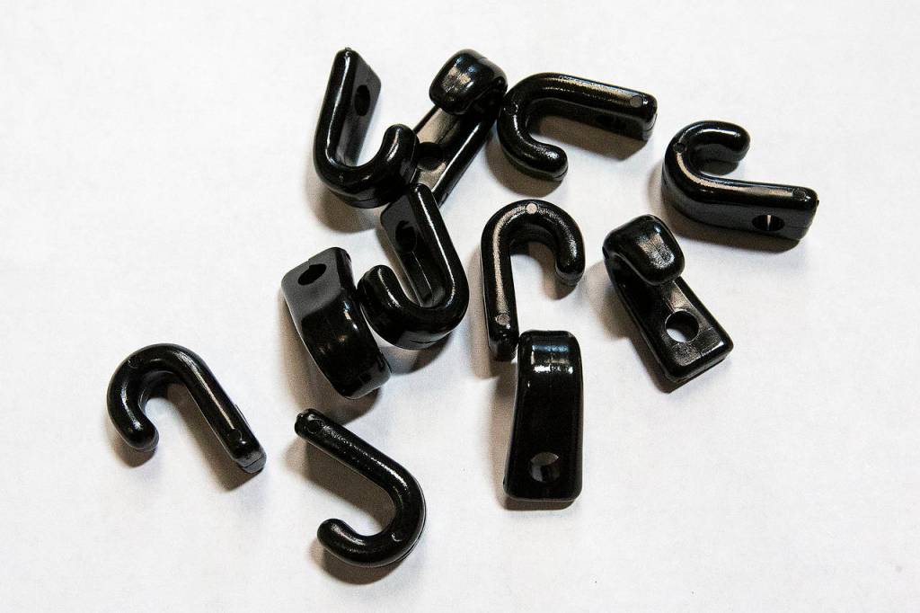 Plastic hooks used on kayaks at Sea-Lect Plastics in Everett. (Ian Terry / The Herald)