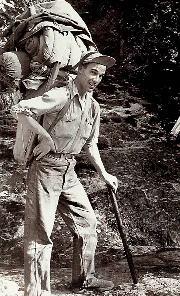 Bill Bates, longtime editor and publisher of the Snohomish Tribune and a mountaineer, carries a huge Trapper Nelson pack in the late 1940s. Bates died April 24 at age 95. (Bates family photo)