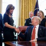 President Donald Trump shakes hands with former Navy pilot Tammie Jo Shults as he meets with crew and passengers of Southwest Airlines Flight 1380 in the Oval Office of the White House on Tuesday. (AP Photo/Carolyn Kaster)