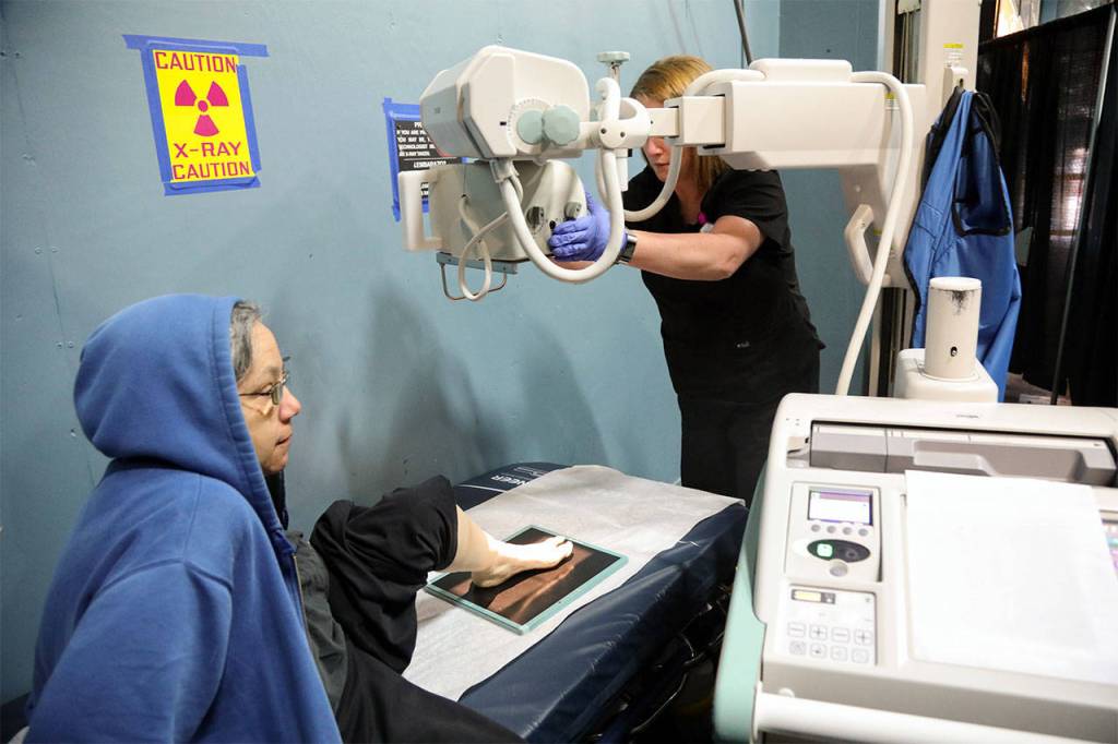 A patient identified as Risa finds out whats troubling her foot with a free X-ray at the AMEN Clinic. (Photo by Heidi Baumgartner)