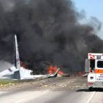 Flames and smoke rise from an Air National Guard C-130 cargo plane after it crashed near Savannah, Georgia, on Wednesday. (James Lavine via AP)