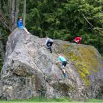 Kids play on glacial erratic in the Martha Lake Airport Park on Friday, May 4, in Lynnwood. The Glacial erratic rock is one of the largest in urban King, Snohomish, and Pierce counties. (Andy Bronson / The Herald)