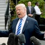 President Donald Trump talks to reporters on Friday at the White House in Washington as he leaves for Dallas to address the National Rifle Association. (AP Photo/J. Scott Applewhite)