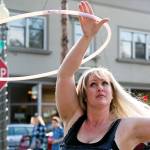 Shannon Dey Zuanich performs with her handmade hoops on the first day of the Snohomish Farmers Market in Snohomish on May 3. (Kevin Clark / The Herald)
