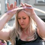 Shannon Dey performs with her handmade hoops on the first day of the Snohomish Farmers Market in Snohomish on May 3, 2018. (Kevin Clark / The Herald)