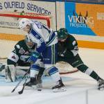 The Silvertips Jake Christiansen (right) and Carter Hart (rear) defend against the Broncos Beck Malenstyn during Game 2 of the WHL finals on May 5, 2018, in Swift Current, Saskatchewan. (Steven Mah / Southwest Booster)